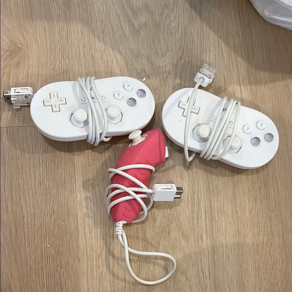 Nintendo wii Pink and White Nunchuk Controllers
